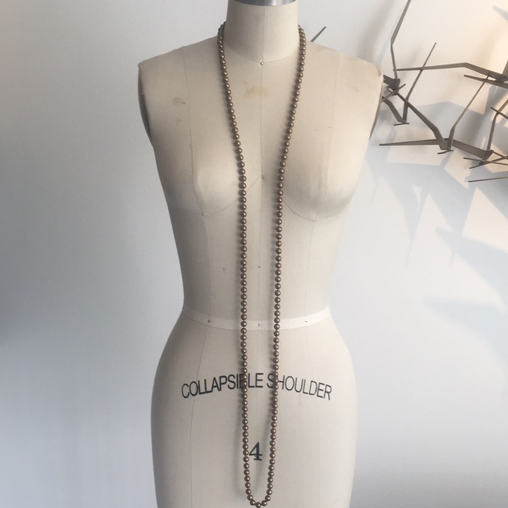 Long strand of copper pearls.